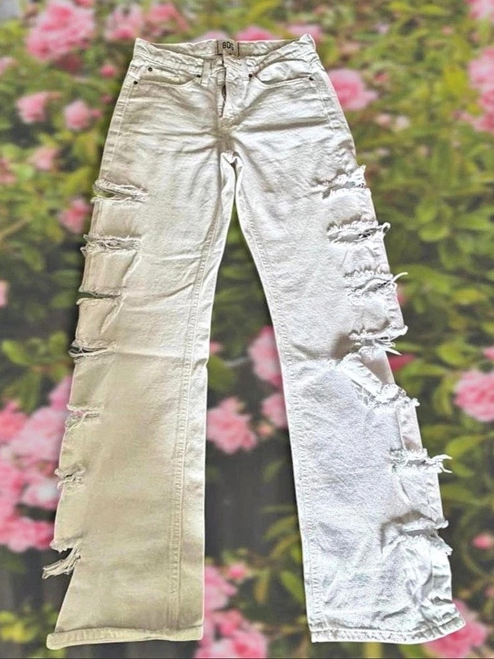 BDG Distressed Straight Leg Jeans in White with slits down the side of the legs